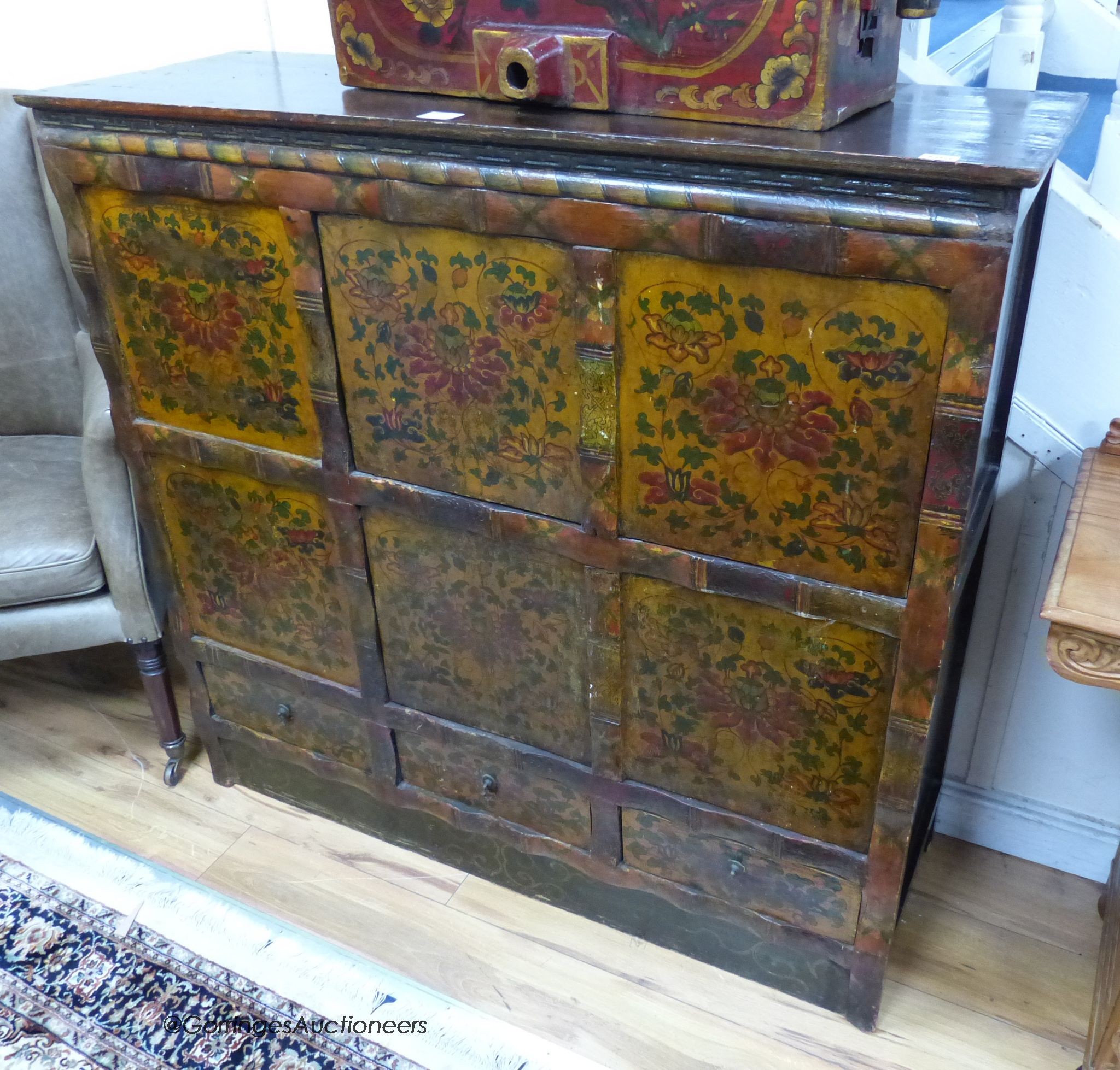 An Eastern painted side cabinet, width 124cm, depth 42cm, height 116cm